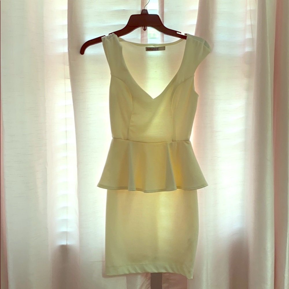 Cream-colored peplum dress
